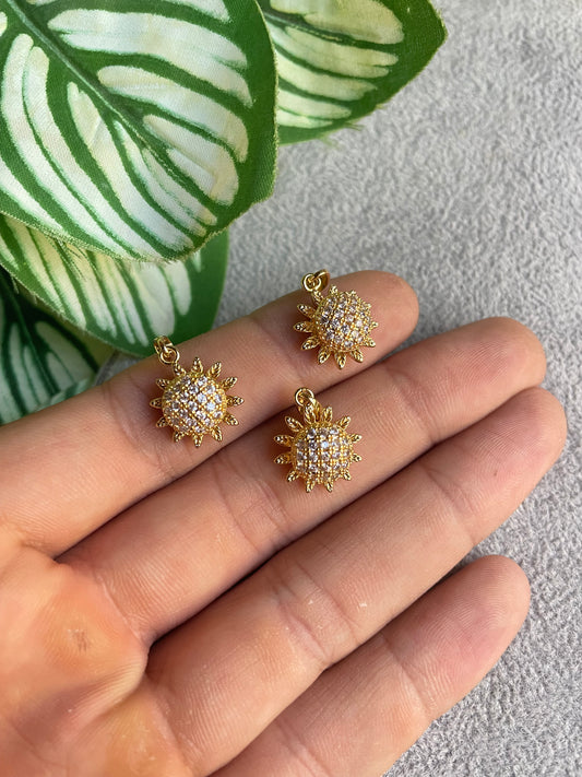 Dije giratorio de girasol